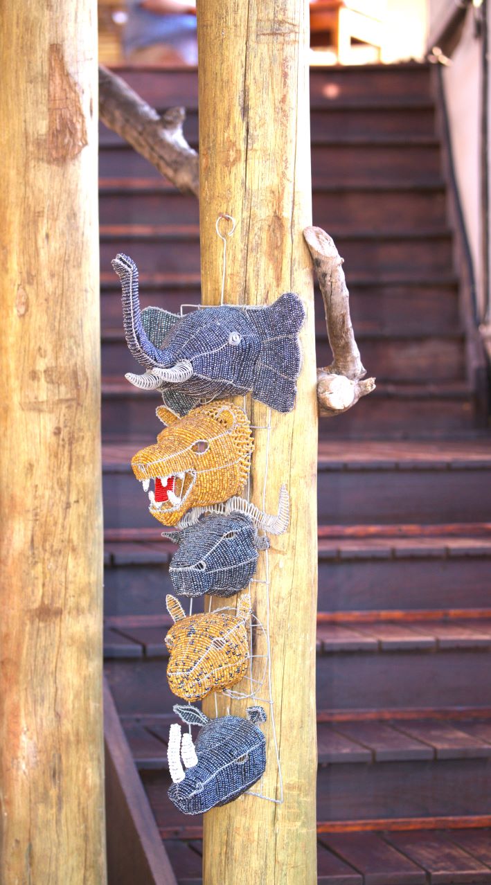 The Big 5 on the pole leading up to the dining area at Buffalo Ridge Safari Lodge