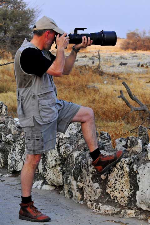 photographing at Okaukuejo waterhole in Etosha