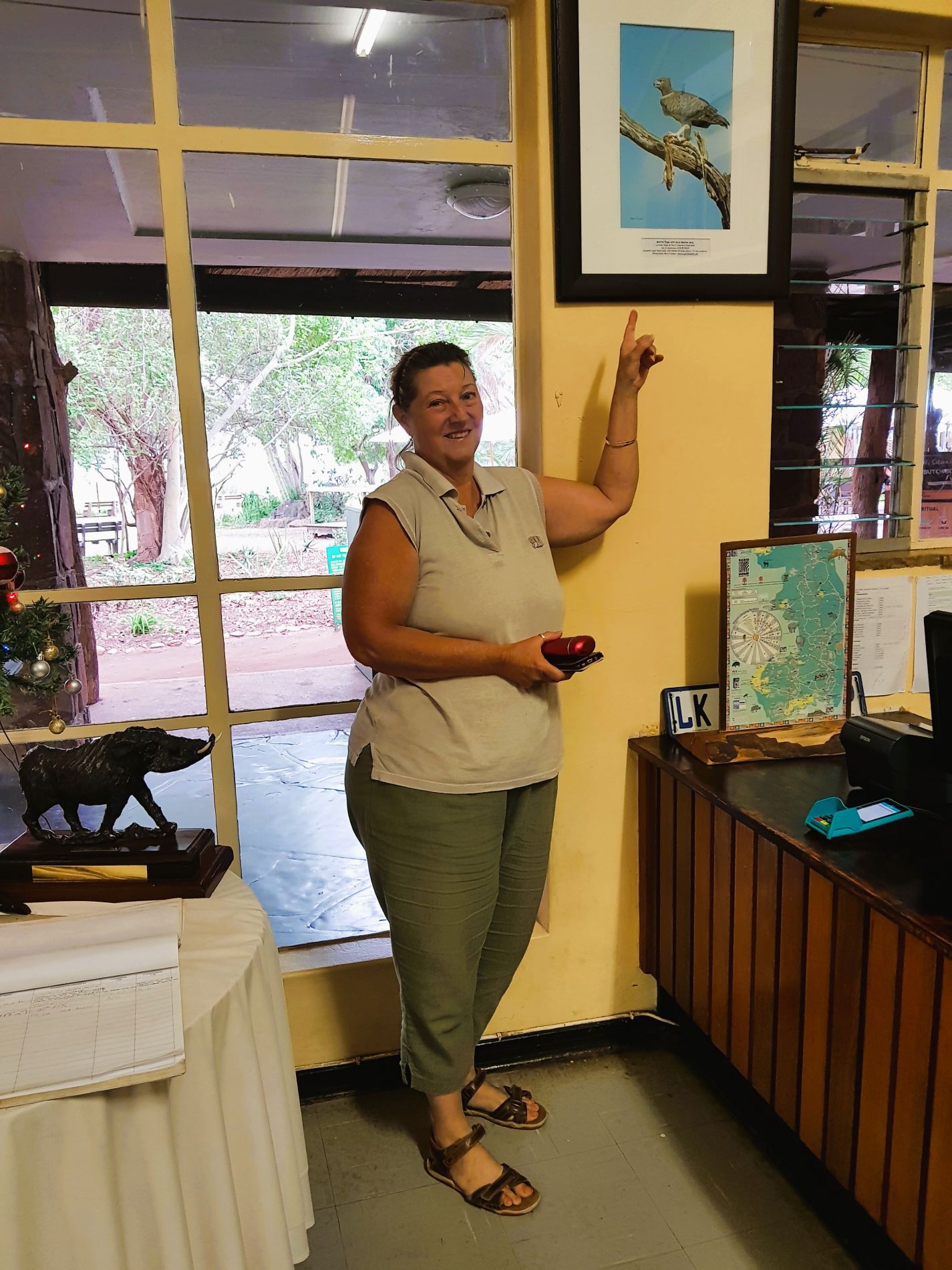 Jen in the Satara reception area with our picture we donated in the Kruger