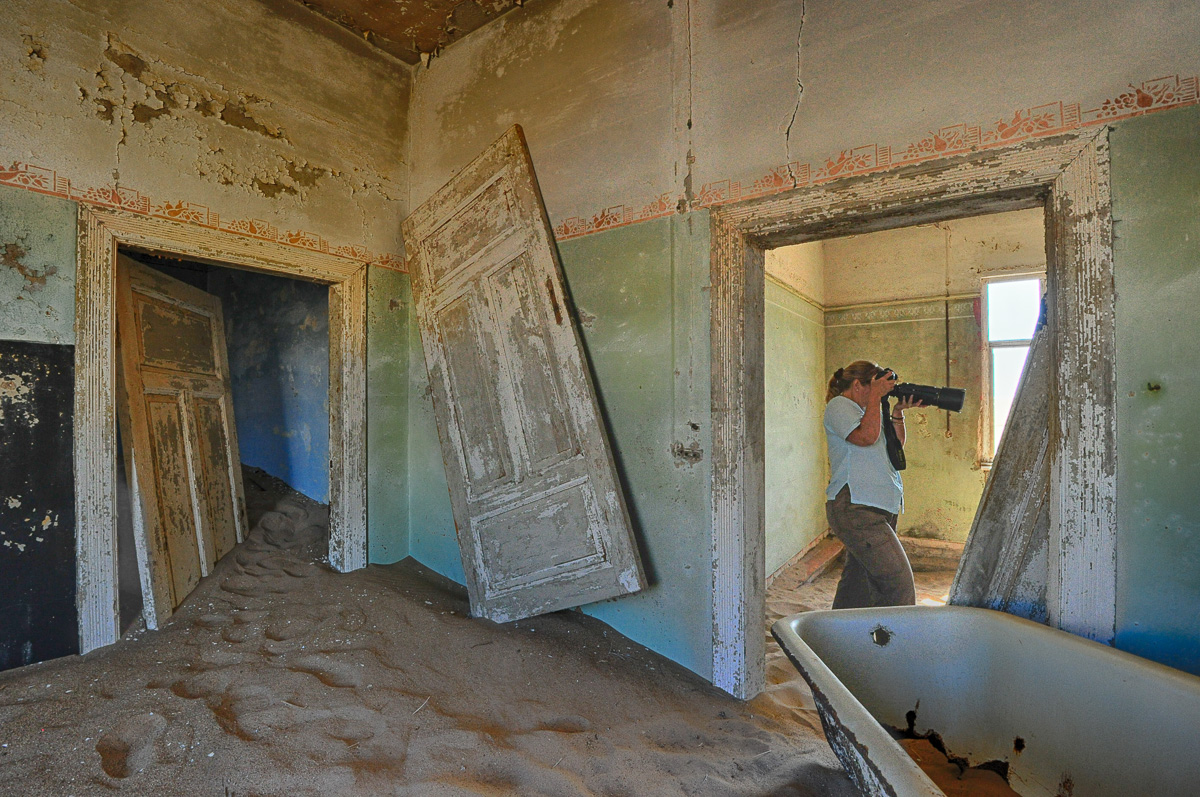 Jenny photographing in one of the old houses in Kolmanskop