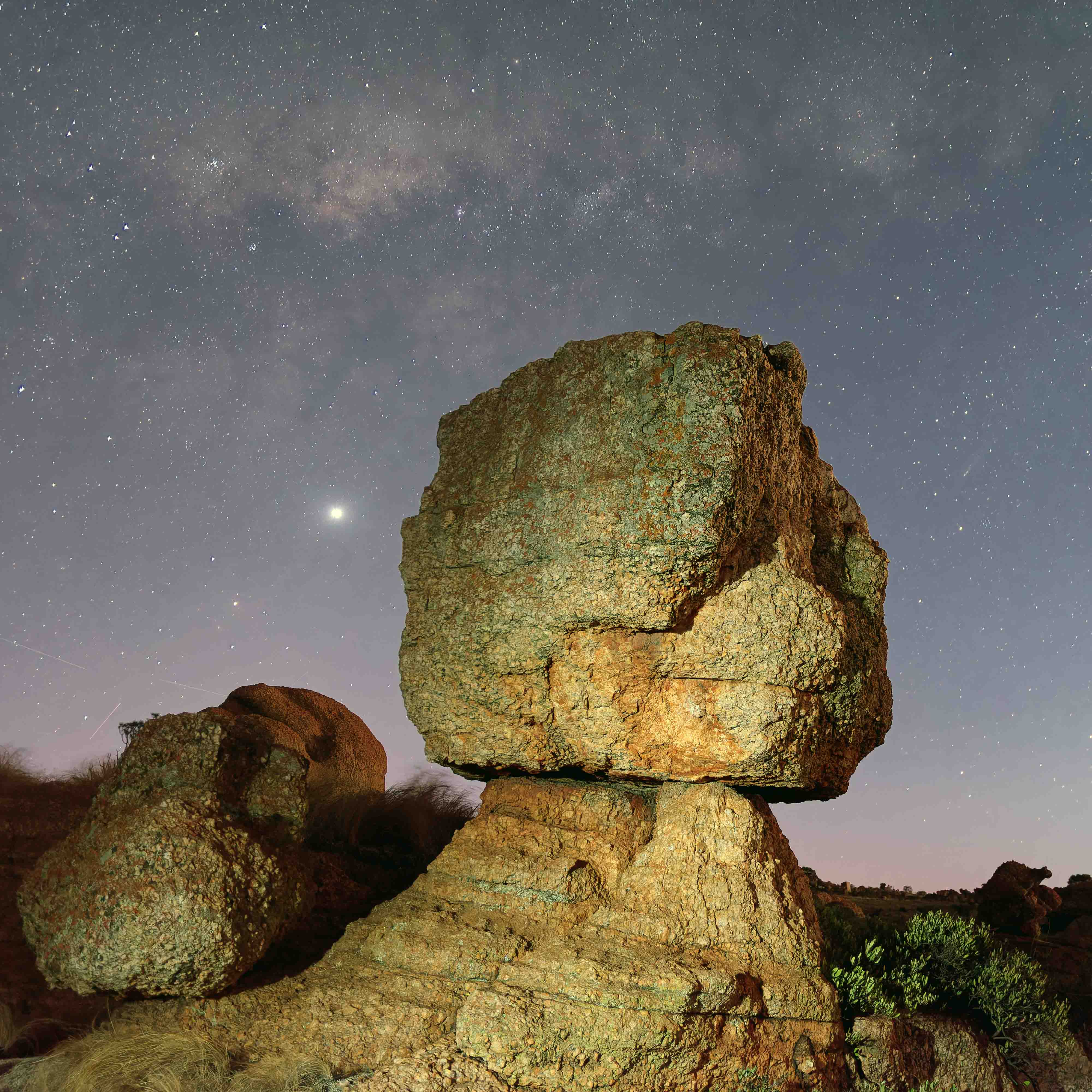 Pedestal rock under the milky way