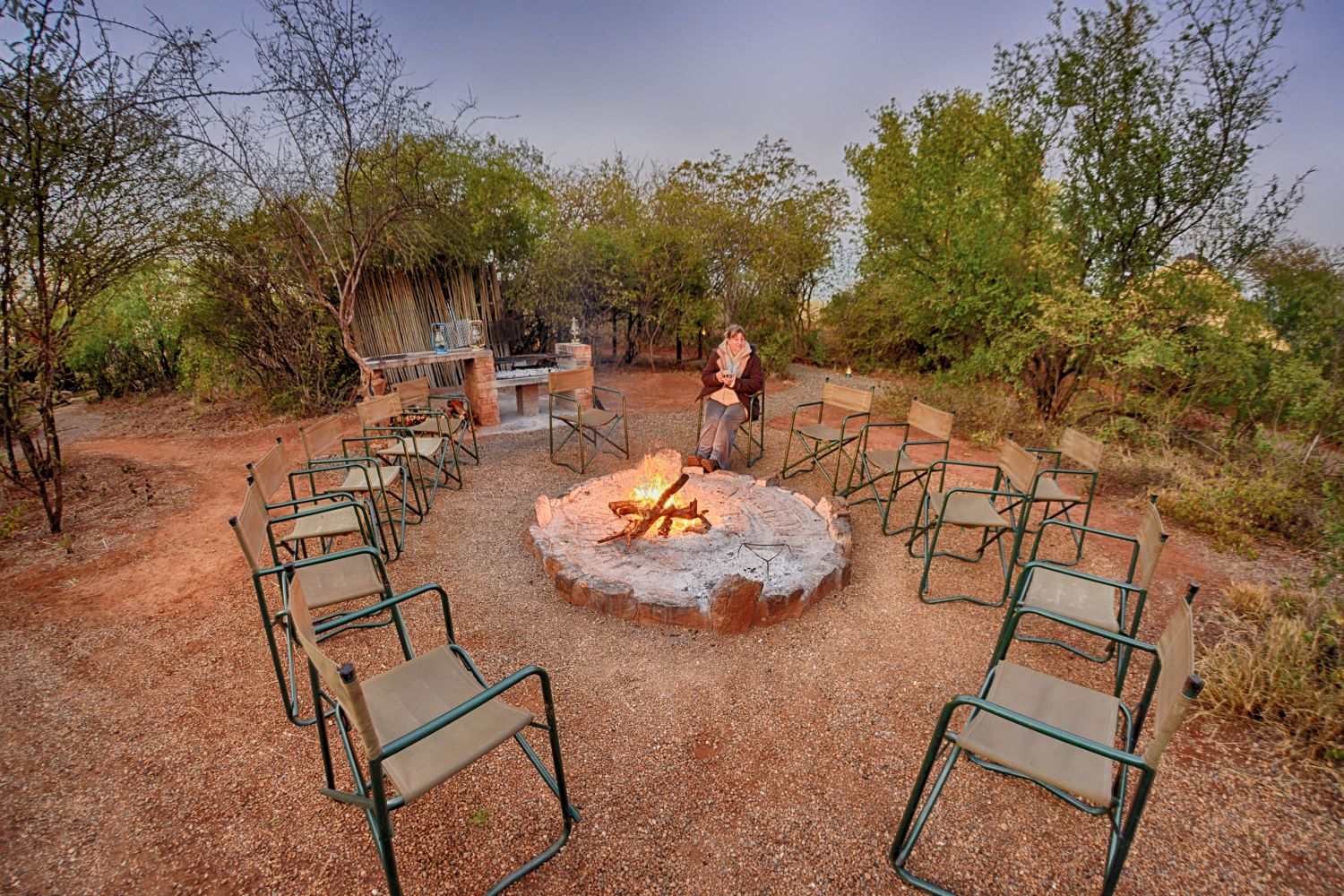 Sitting round the fire pit at Mosetlhas boma