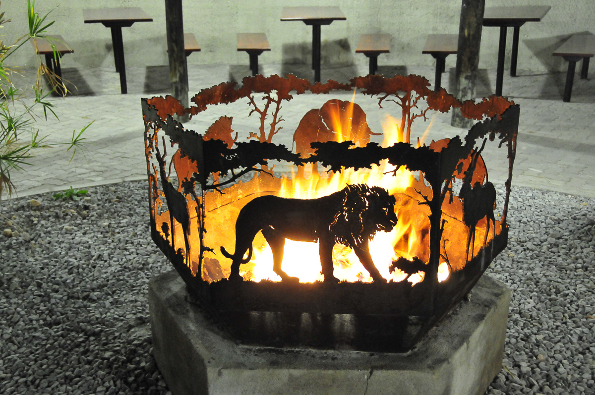 Fire pit with lion cut out at Okaukuejo restaurant