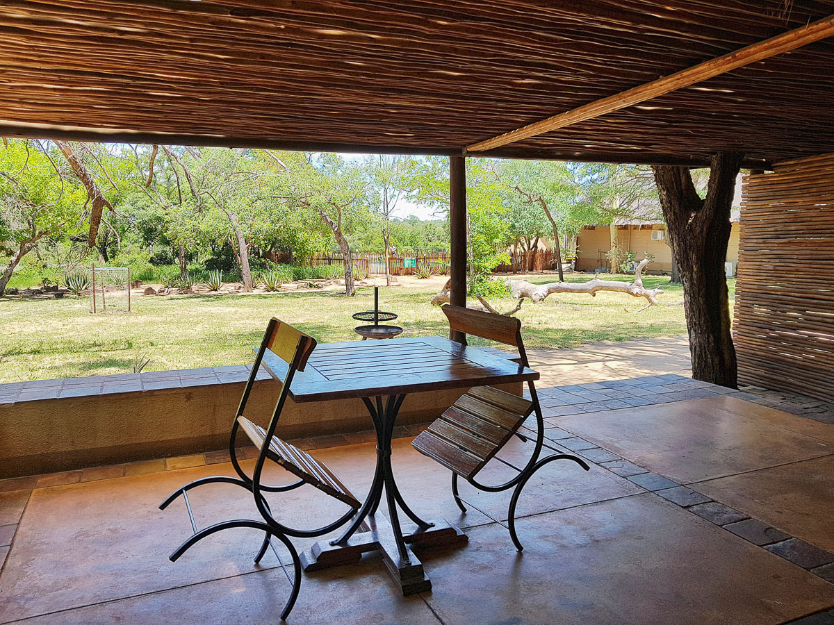 veranda looking onto the garden and Orpen camp swimming pool in the background