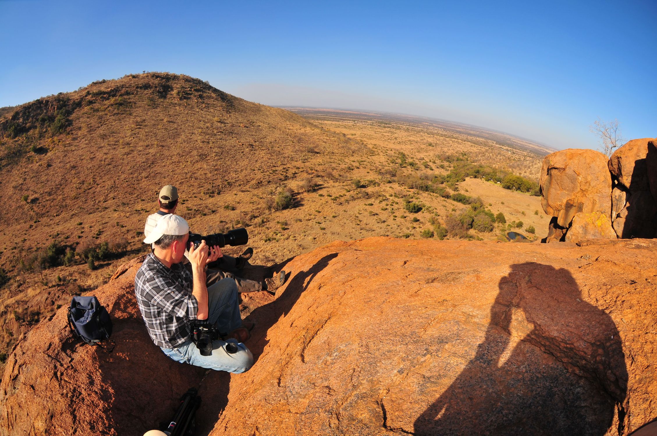 Mario photographing from the hill