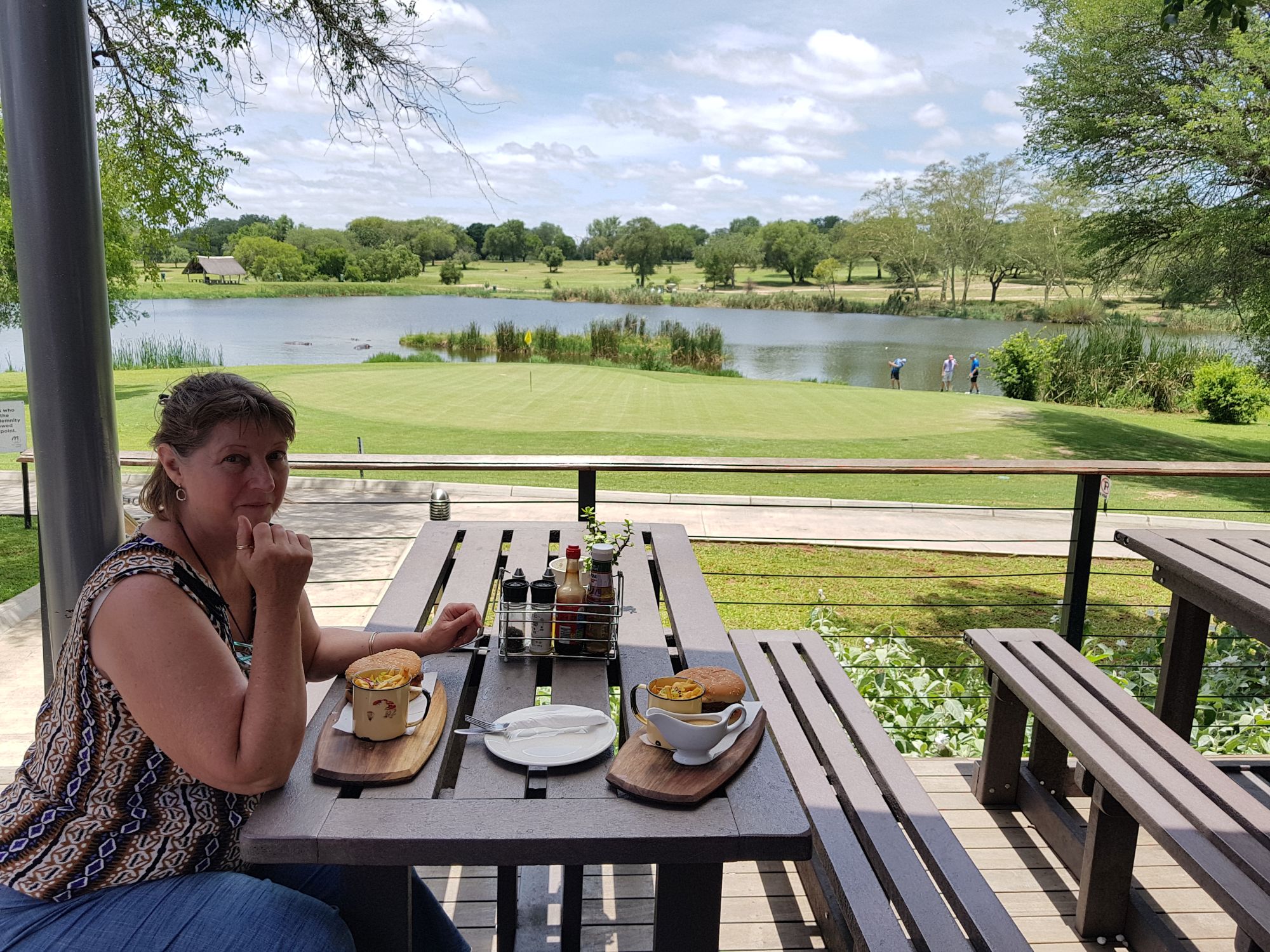 Jen having a chicken burger at Skukuza Gold course