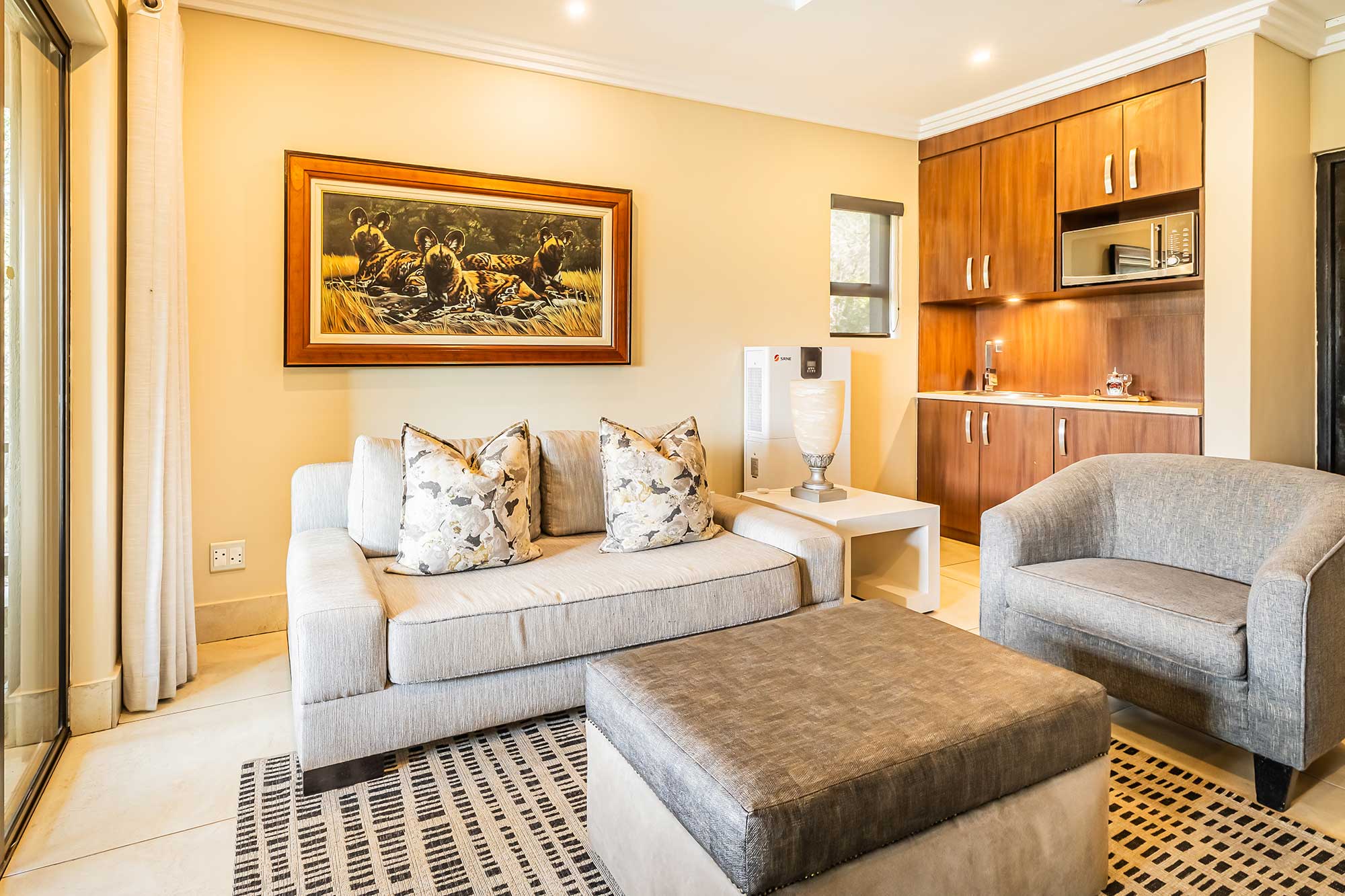 Executive suite lounge at Shepherds Tree Game Lodge