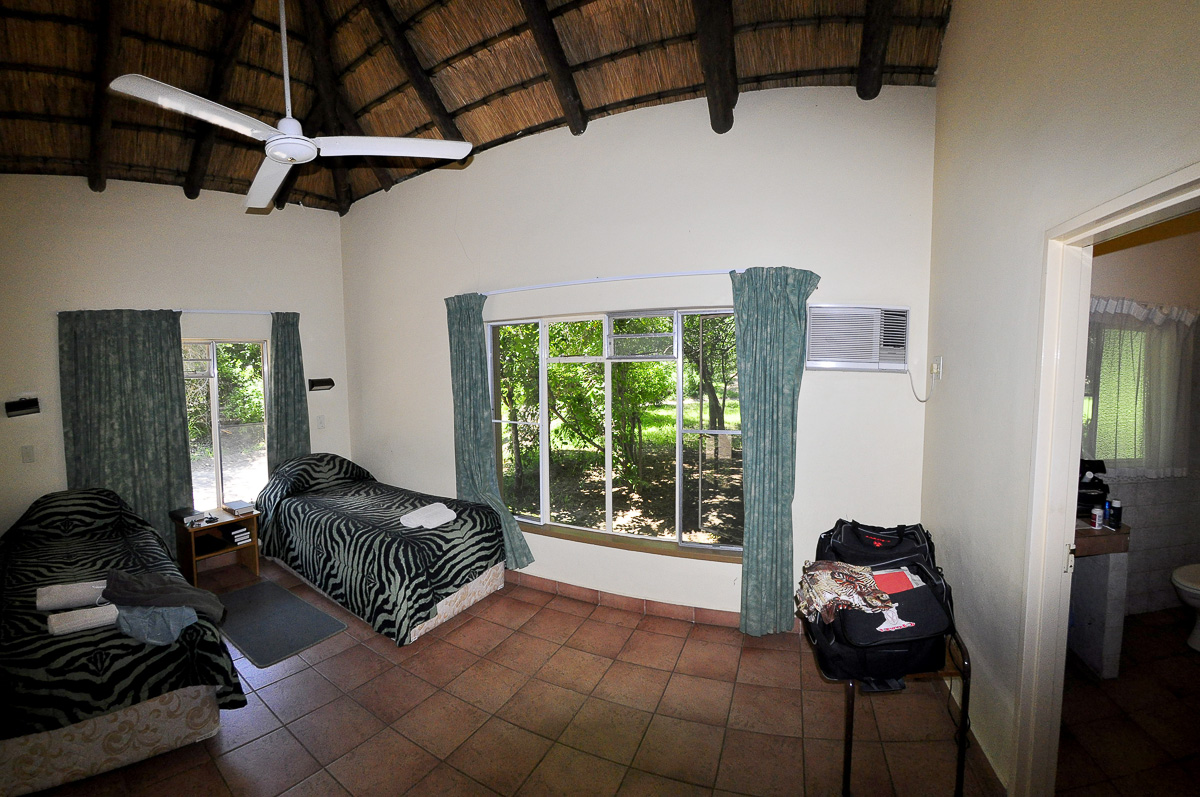 Family cottage bedroom and bathroom at Skukuza