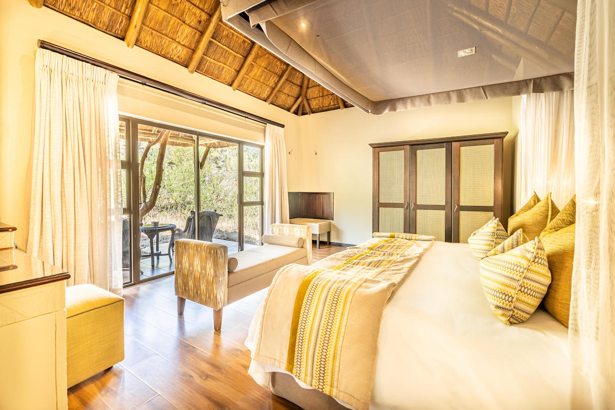 Standard suite bedroom at Ivory Tree Lodge