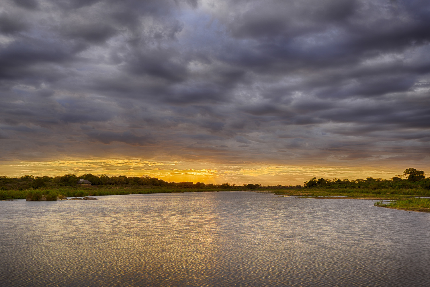 Sunset behind Lower Sabie camp image taken from the low level bridge overlooking the Sabie River in the Kruger National Park