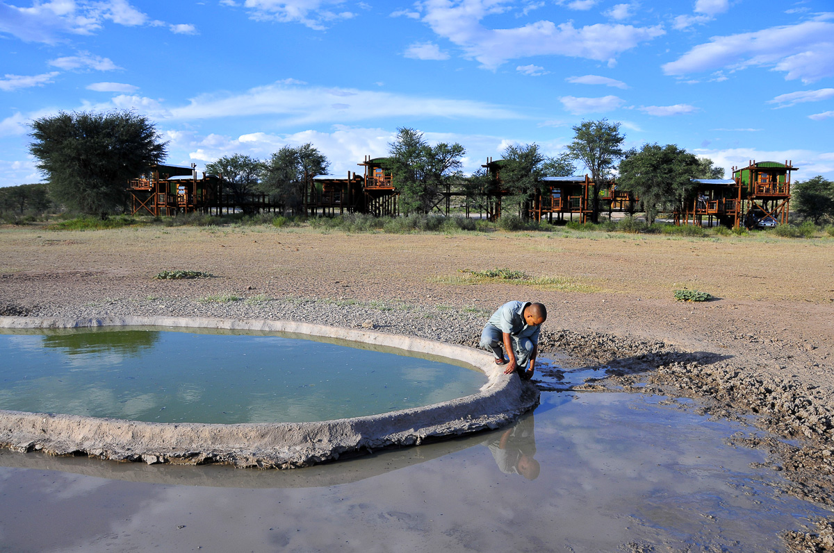 Our camp attendant checking the waterhole at Urikaruus Wilderness camp
