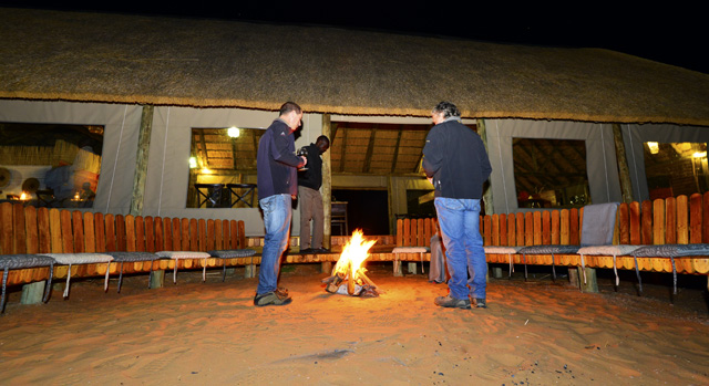Guest gathering by the Boma fire
