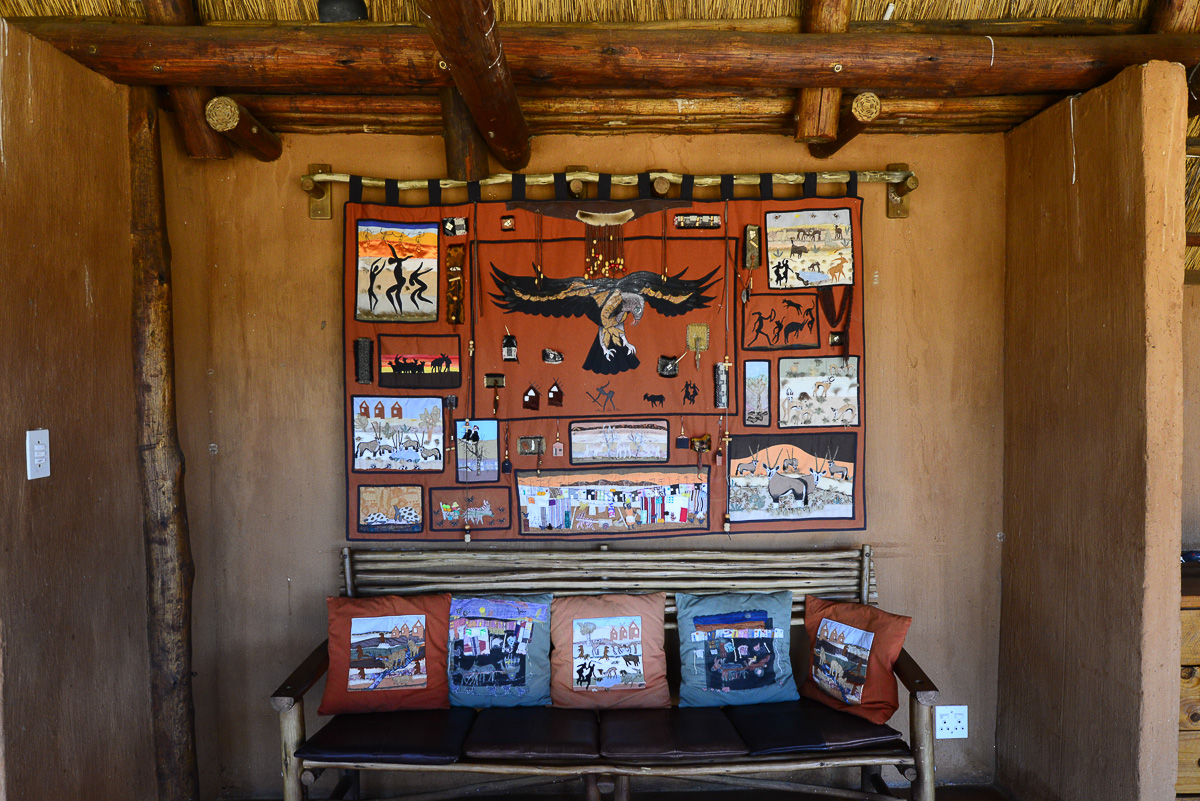 seating area and wall hanging at !Xaus lodge