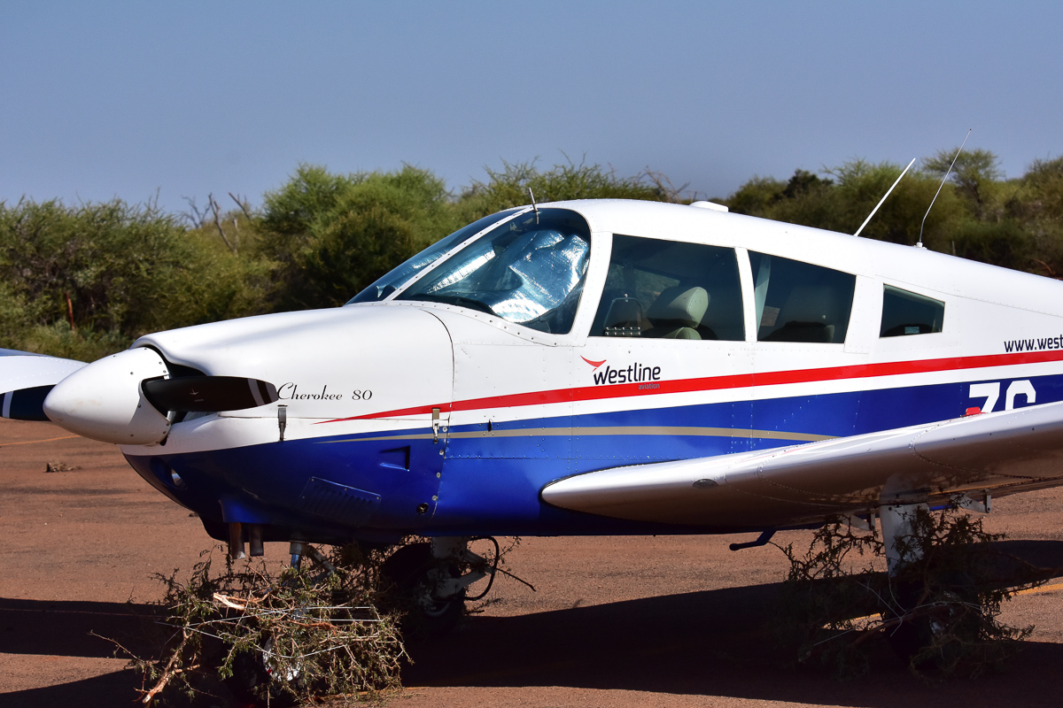 airplane on eastern airstrip with wheel protection